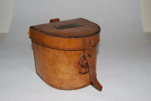 4 1/2 THOMAS J. CONROY Leather Reel Case. 4 in. high x 4 in. deep. Will hold a 3 Hardy Perfect or a 2/0 or 3/0 E. vom Hofe or Zwarg. Marked on base: Thomas J. Conroy New York. N/S plate on top of case, suitable for engraving. Strap refastened or possibly replaced; Belt strap on rear. [1840-1921]